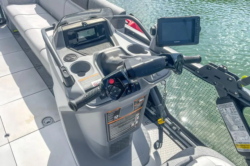 Slide: The Image of 2023 Sea-Doo Switch Cruise 21 dashboard with steering and navigation controls. - 7