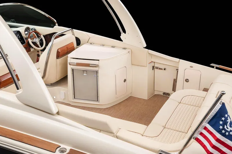 Slide: The Image of Manufacturer Provided Image: 2025 Chris-Craft Launch 31 GT interior with luxurious seating and American flag detail. - 13