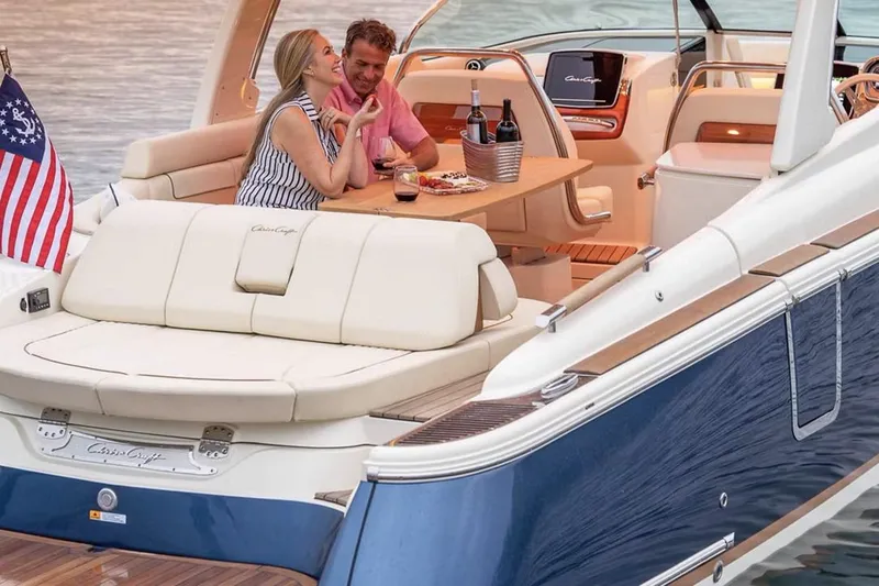 Slide: The Image of Manufacturer Provided Image: Couple enjoying a meal on a 2025 Chris-Craft Launch 31 GT boat. - 3