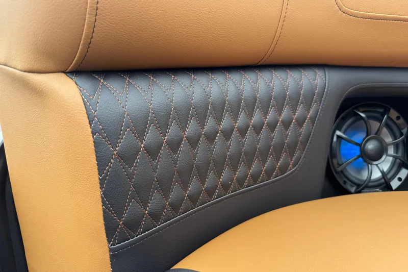 Slide: The Image of Luxurious leather interior of 2026 Premier 230 Solaris RL with diamond stitching and speaker detail. - 15