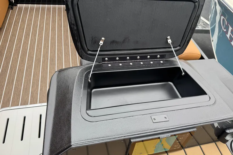 Slide: The Image of Open storage compartment on 2026 Premier 230 Solaris RL boat, featuring sleek design and functionality. - 18