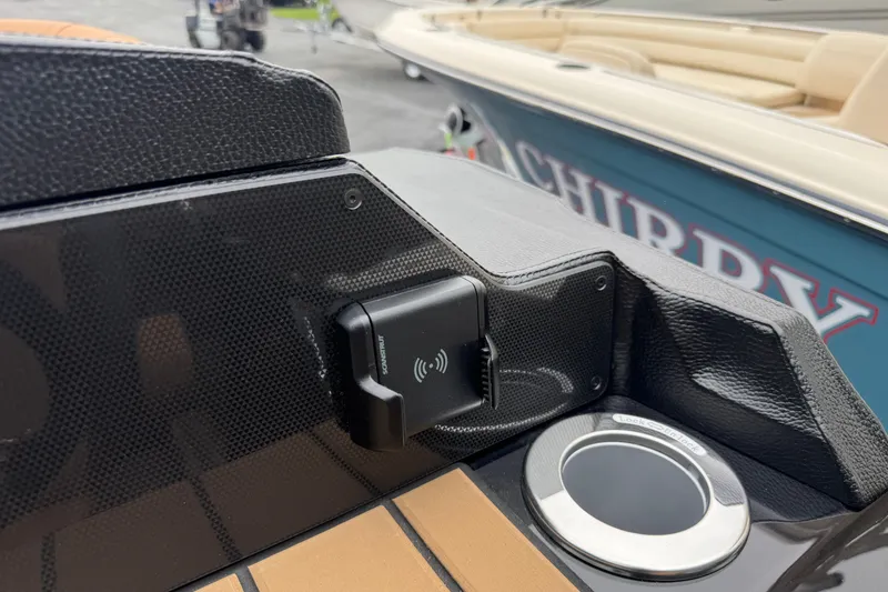 Slide: The Image of 2026 Premier 230 Solaris RL boat dashboard with wireless charger and cup holder. - 19