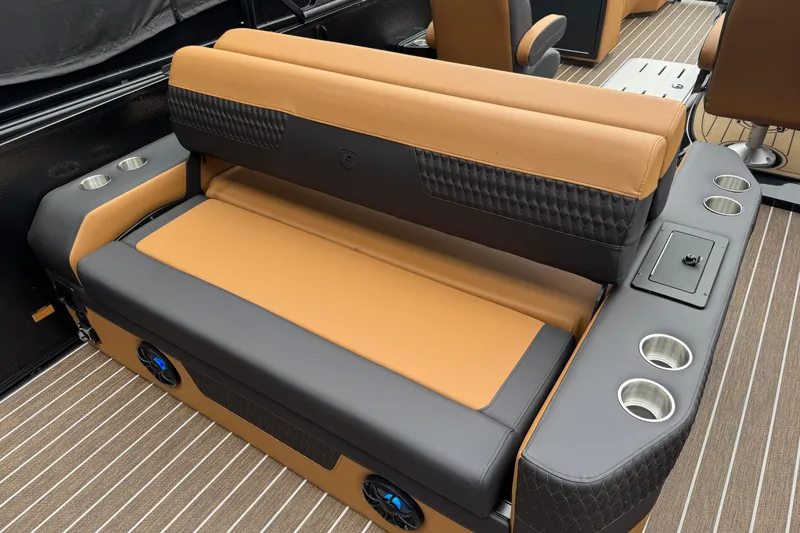 Slide: The Image of 2026 Premier 230 Solaris RL boat interior with luxurious seating and cup holders. - 28