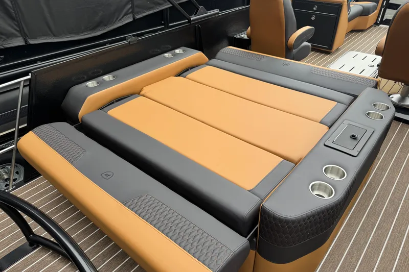Slide: The Image of 2026 Premier 230 Solaris RL boat interior with luxurious tan and gray seating, cup holders. - 30