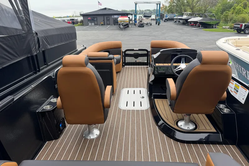 Slide: The Image of Interior of 2026 Premier 230 Solaris RL boat with luxurious seating and modern dashboard. - 33