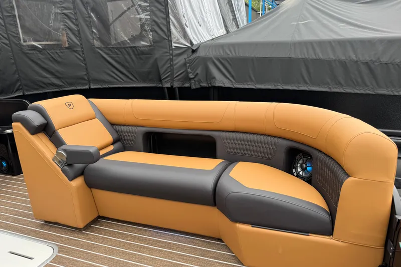 Slide: The Image of Luxurious seating on 2026 Premier 230 Solaris RL boat, featuring tan and gray upholstery. - 38