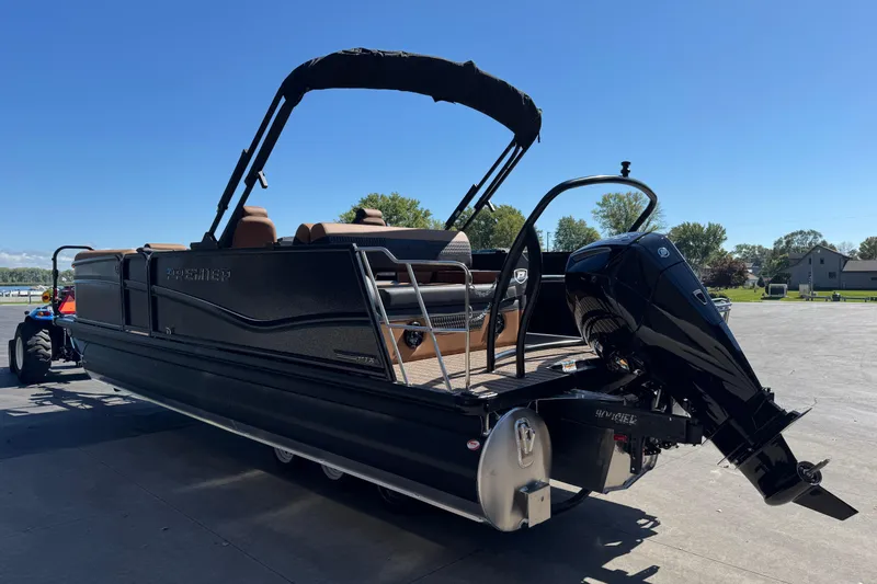 Slide: The Image of 2026 Premier 230 Solaris RL pontoon boat with outboard motor on a sunny day. - 4
