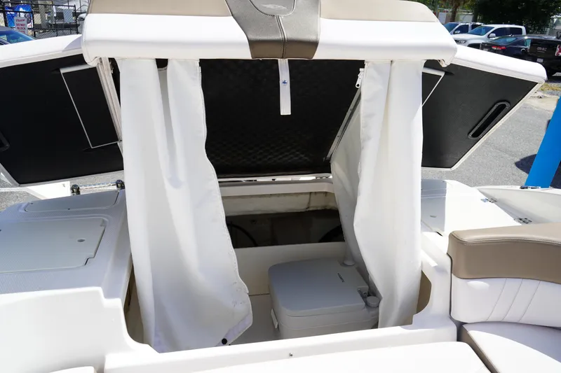Slide: The Image of 2020 Chaparral 23 SSi OB boat interior with privacy curtain and seating area. - 10