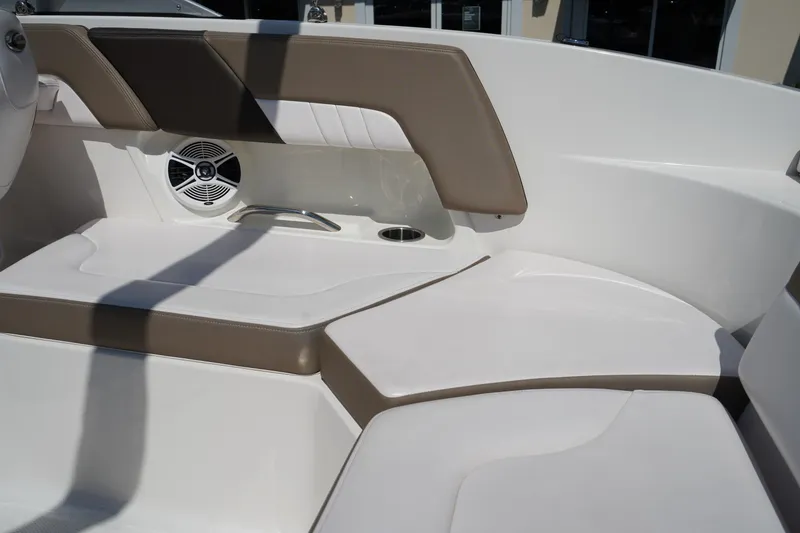 Slide: The Image of 2020 Chaparral 23 SSi OB boat interior with cushioned seating and speaker. - 11