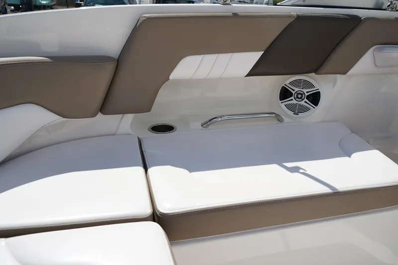Slide: The Image of 2020 Chaparral 23 SSi OB boat interior with cushioned seating and speaker. - 12