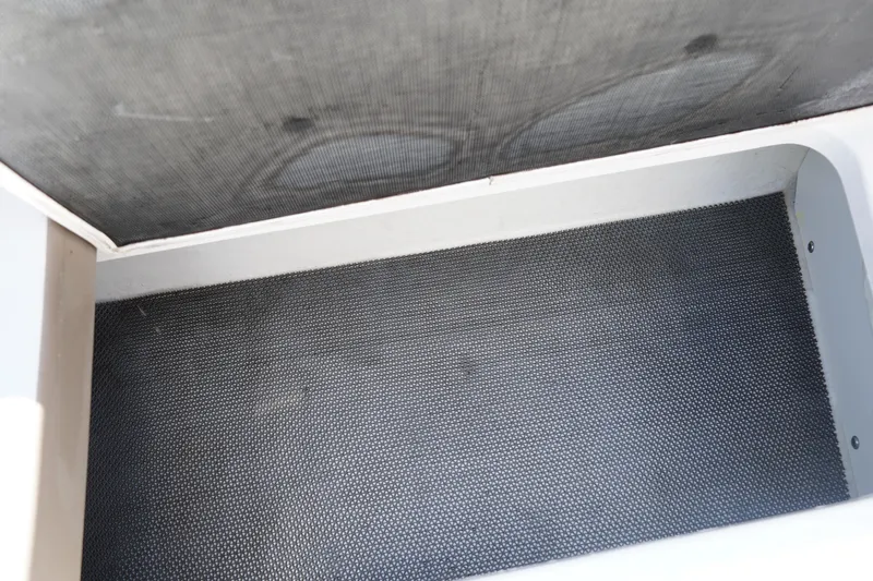 Slide: The Image of Storage compartment of 2020 Chaparral 23 SSi OB boat, featuring textured interior. - 13