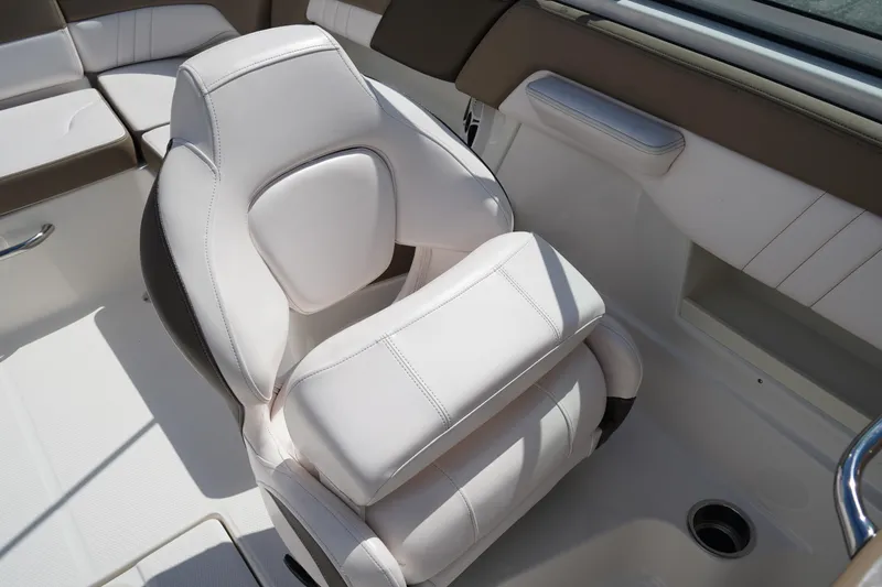 Slide: The Image of Luxurious seating in 2020 Chaparral 23 SSi OB boat, featuring white upholstery. - 17