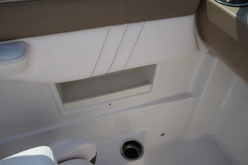 Slide: The Image of 2020 Chaparral 23 SSi OB boat interior detail with white and beige upholstery. - 19