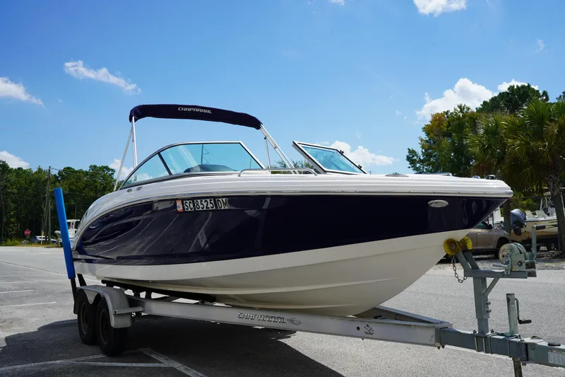 Slide: The Image of 2020 Chaparral 23 SSi OB boat on trailer under blue sky. - 3