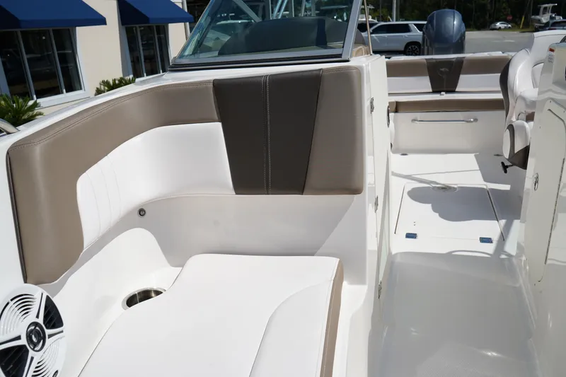 Slide: The Image of 2020 Chaparral 23 SSi OB boat interior with white and beige seating. - 34