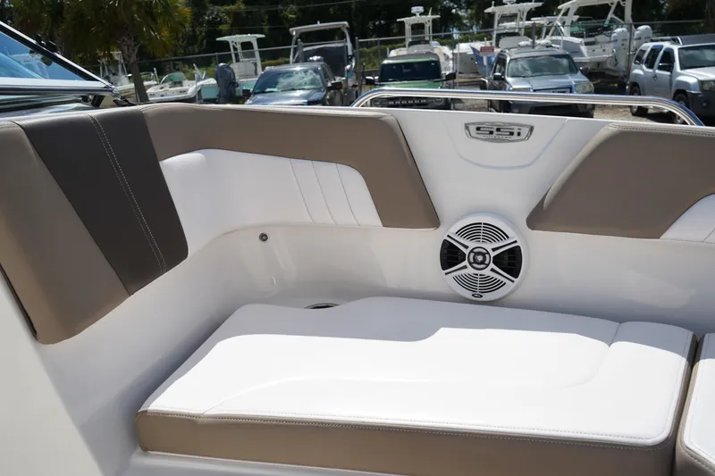 Slide: The Image of 2020 Chaparral 23 SSi OB boat interior with cushioned seating and speaker. - 38