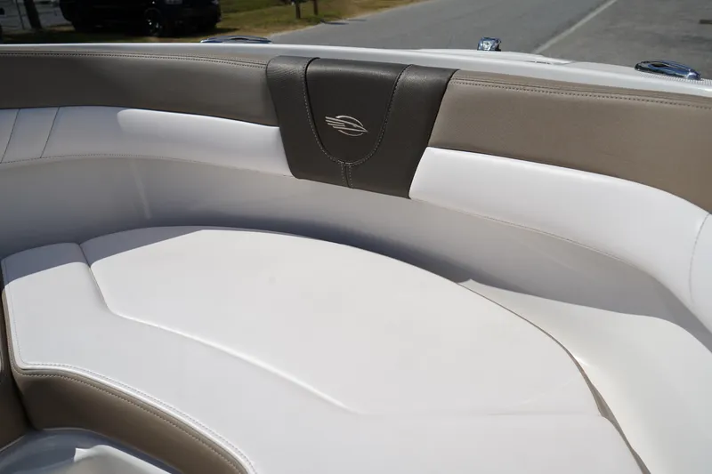 Slide: The Image of 2020 Chaparral 23 SSi OB boat interior with white and beige seating. - 39