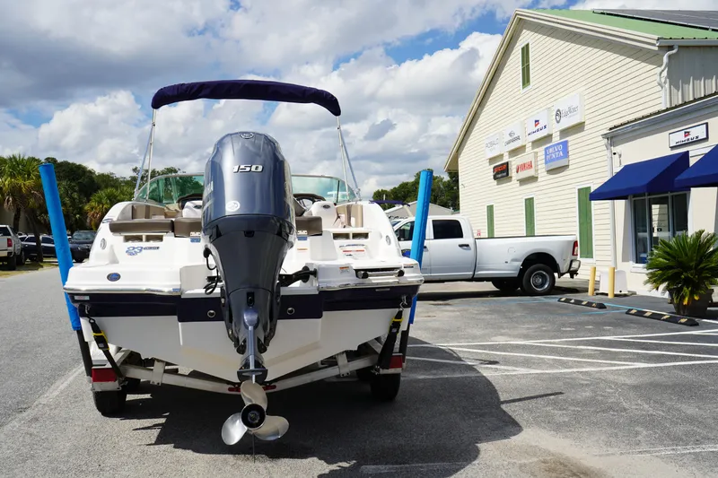Slide: The Image of 2020 Chaparral 23 SSi OB boat with Yamaha 150 engine at dealership parking lot. - 6