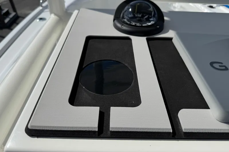 Slide: The Image of Dashboard of 2025 Parker 230 Coastal Elite boat with compass and navigation equipment. - 17