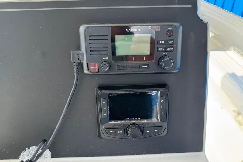 Slide: The Image of Garmin marine radio and control panel on 2025 Parker 230 Coastal Elite boat. - 18