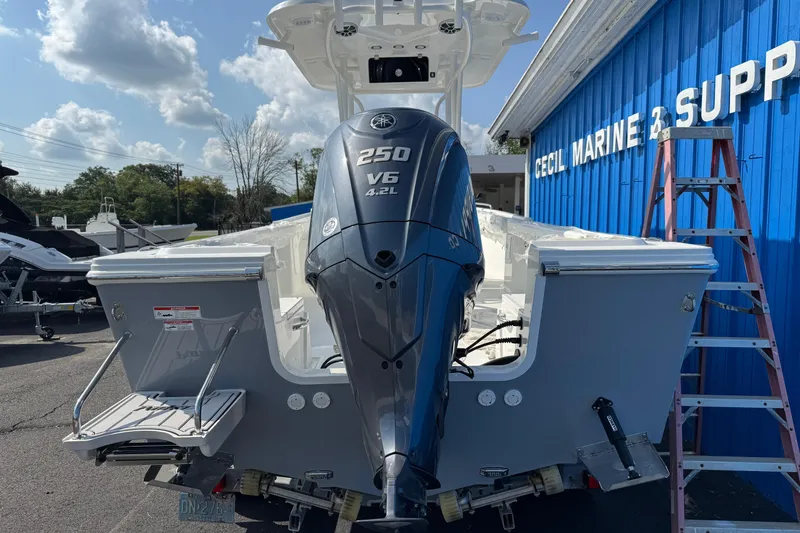 Slide: The Image of 2025 Parker 230 Coastal Elite boat with Yamaha 250 V6 engine at marine supply store. - 8