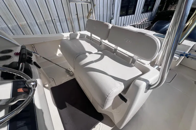 Slide: The Image of 2007 Pursuit C 300 Center Console boat with Yamaha 250 engines, featuring a livewell and storage. - 12