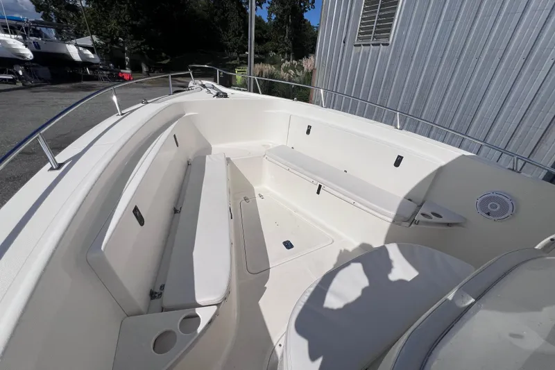 Slide: The Image of 2007 Pursuit C 300 Center Console boat on calm water, featuring spacious deck and modern design. - 17