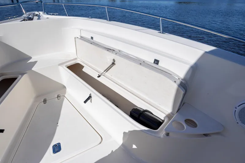 Slide: The Image of 2007 Pursuit C 300 Center Console boat with open storage compartment on deck. - 27