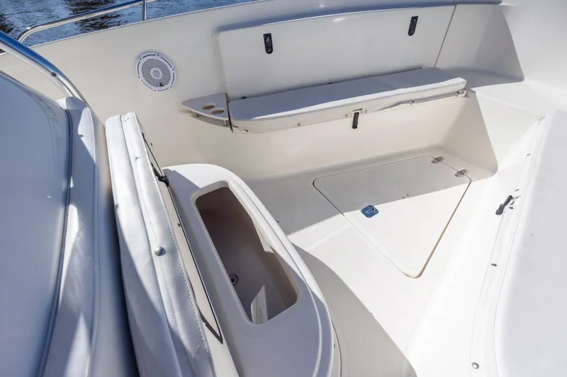 Slide: The Image of 2007 Pursuit C 300 Center Console boat interior with seating and storage compartments. - 28