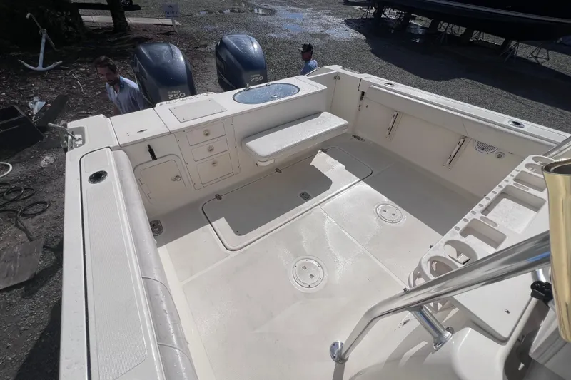 Slide: The Image of 2007 Pursuit C 300 Center Console boat cruising on a calm lake. - 7