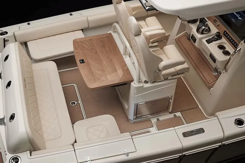 Slide: The Image of Manufacturer Provided Image: Luxurious 2025 Chris-Craft Catalina 30 interior with elegant seating and wooden table. - 11