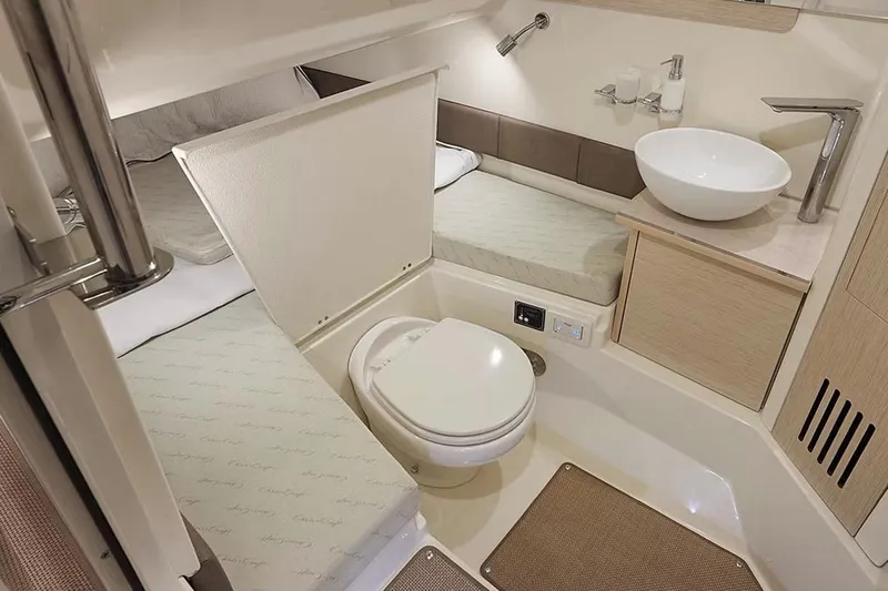 Slide: The Image of Manufacturer Provided Image: 2025 Chris-Craft Catalina 30 interior bathroom with modern fixtures and compact design. - 13
