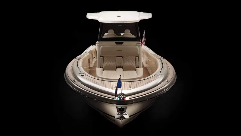 Slide: The Image of Manufacturer Provided Image: 2025 Chris-Craft Catalina 30 boat, front view, elegant design, dark background. - 2