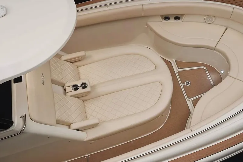 Slide: The Image of Manufacturer Provided Image: 2025 Chris-Craft Catalina 30 interior with beige seating and cup holders. - 4