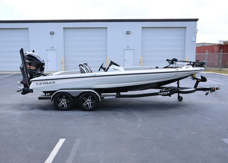 Slide: The Image of 2020 Caymas CX 20 PRO boat on trailer, parked in industrial area. - 0