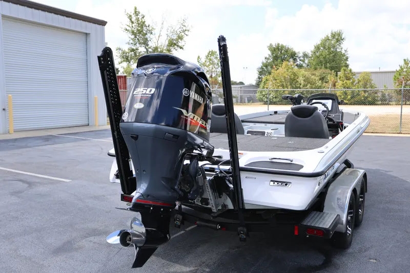 Slide: The Image of 2020 Caymas CX 20 PRO boat with Yamaha 250 engine, parked outdoors. - 1
