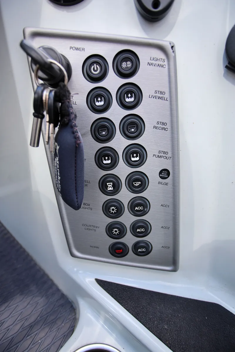 Slide: The Image of Control panel of 2020 Caymas CX 20 PRO boat with various function buttons and key. - 10