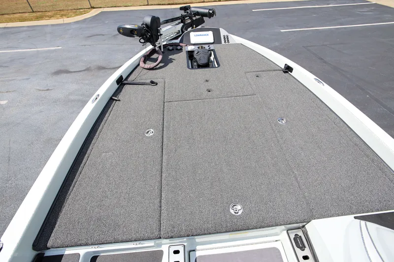 Slide: The Image of 2020 Caymas CX 20 PRO boat deck with trolling motor and carpeted surface. - 13