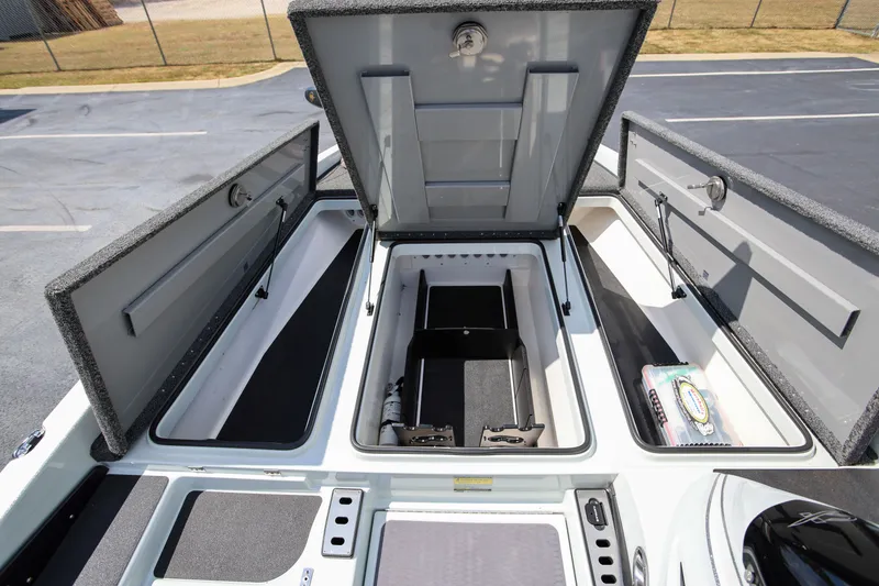 Slide: The Image of 2020 Caymas CX 20 PRO boat storage compartments open, showcasing spacious interior. - 14