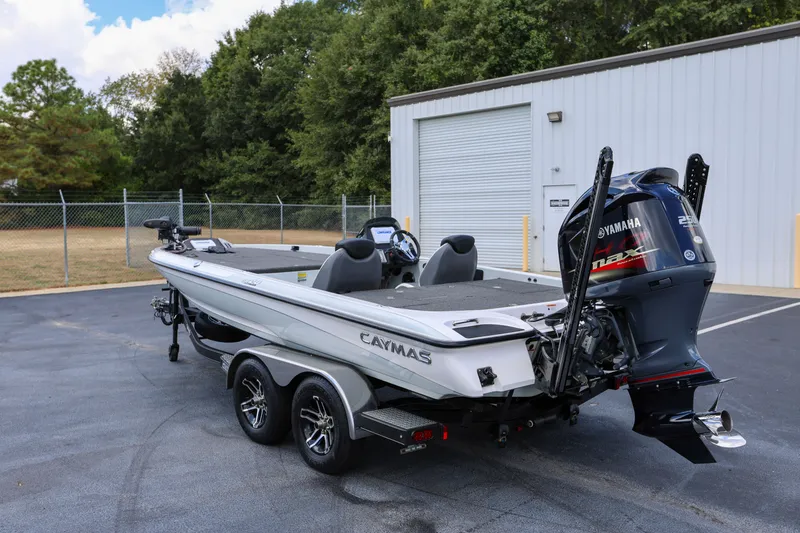 Slide: The Image of 2020 Caymas CX 20 PRO boat with Yamaha engine, parked outdoors. - 3