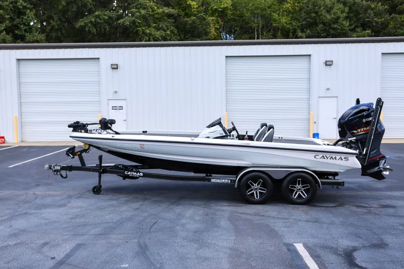Slide: The Image of 2020 Caymas CX 20 PRO boat on trailer, parked outside a building. - 4