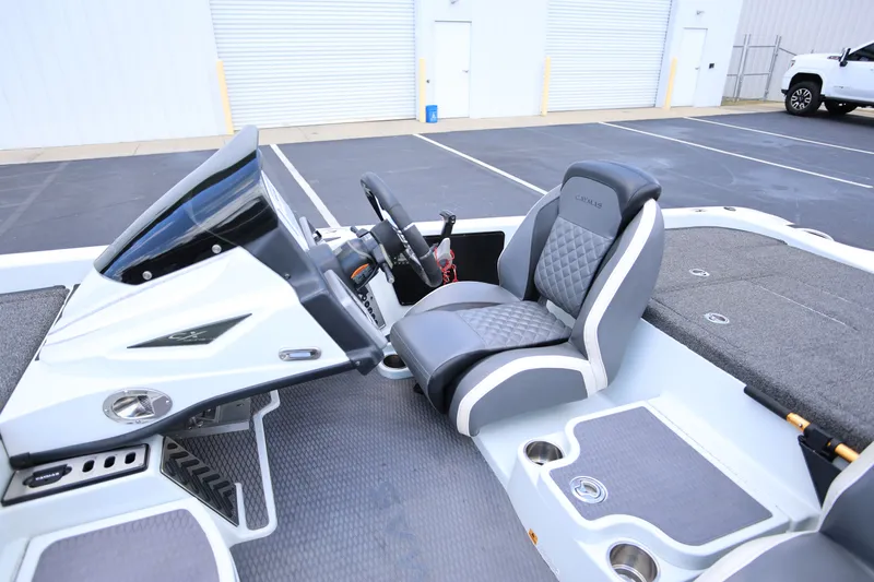 Slide: The Image of 2020 Caymas CX 20 PRO boat interior with steering console and cushioned seat. - 8