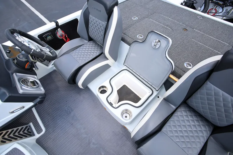 Slide: The Image of 2020 Caymas CX 20 PRO boat interior with gray seating and storage compartment. - 9