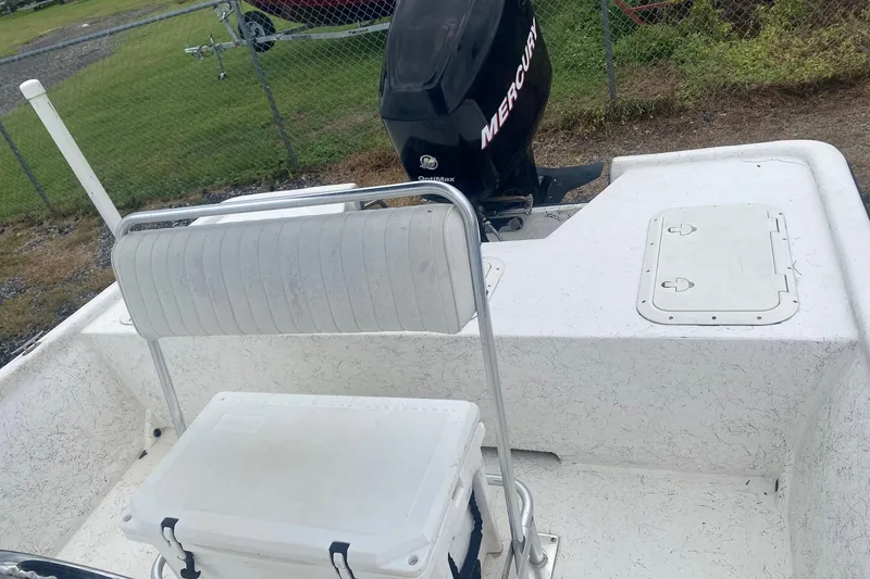 Slide: The Image of 2006 Mako 191 Inshore boat with Mercury outboard motor and seating area. - 3