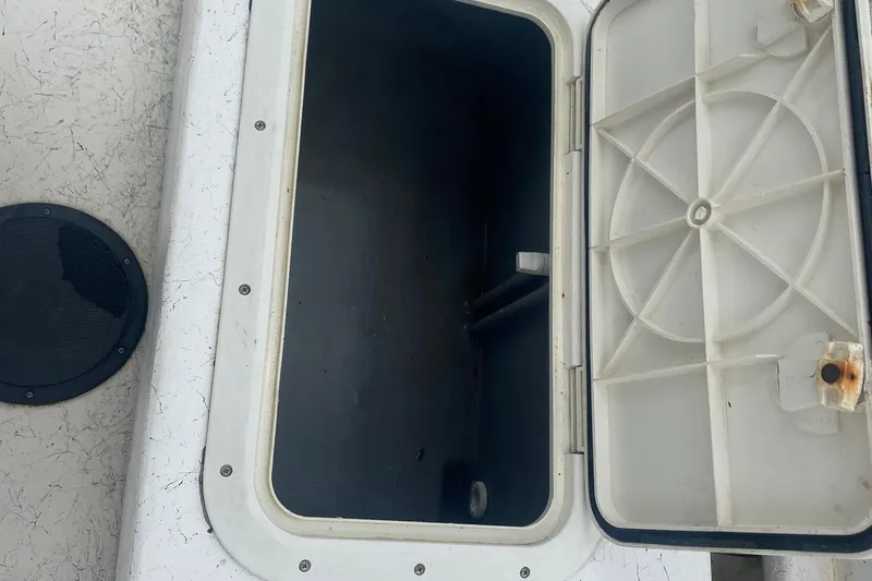 Slide: The Image of Open storage compartment on a 2006 Mako 191 Inshore boat. - 5
