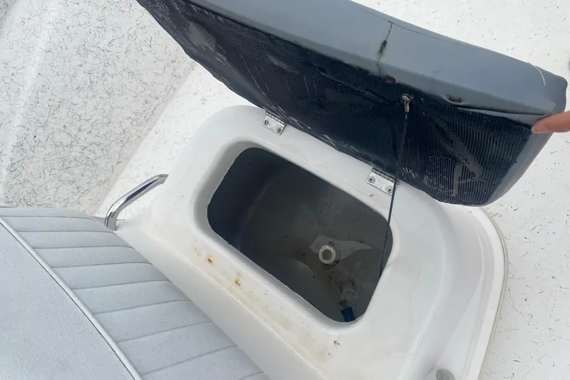 Slide: The Image of Open storage compartment on a 2006 Mako 191 Inshore boat. - 9