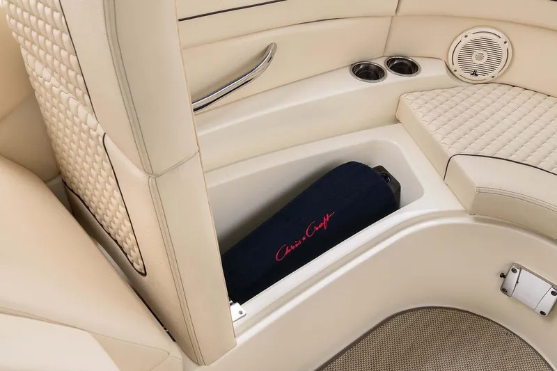 Slide: The Image of Manufacturer Provided Image: 2025 Chris-Craft Launch 28 GT interior with beige seating and storage compartment. - 10
