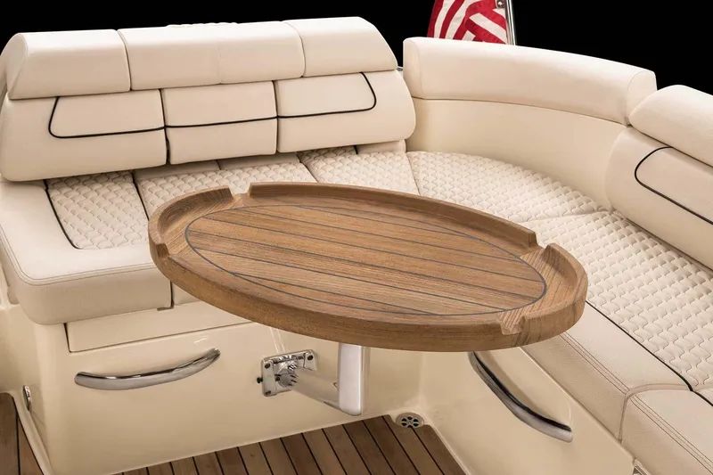 Slide: The Image of Manufacturer Provided Image: Luxurious interior of 2025 Chris-Craft Launch 28 GT with elegant seating and wooden table. - 13