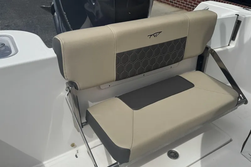 Slide: The Image of 2020 Tidewater 210 CC Adventure boat seat with beige and gray upholstery. - 11