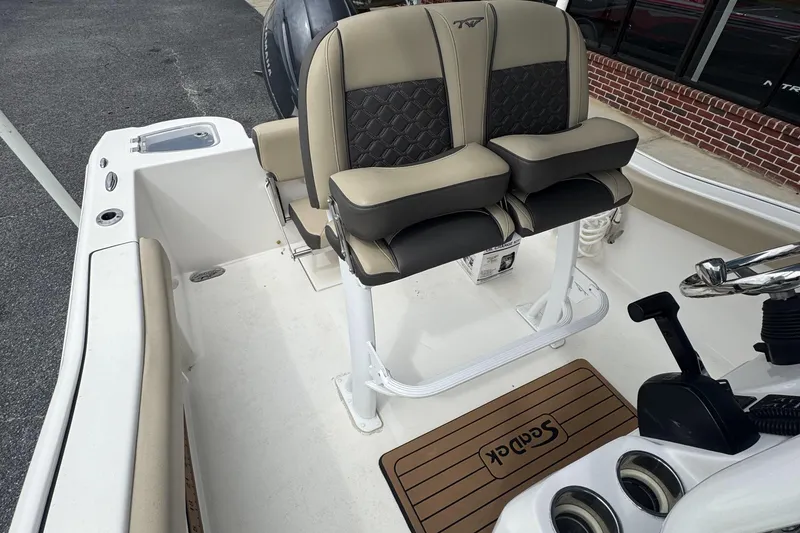 Slide: The Image of 2020 Tidewater 210 CC Adventure boat interior with dual seats and steering console. - 16